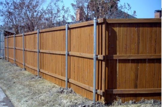 Wood Fence with Metal Poles Picture