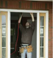 Handyman Working on Door Frame Picture